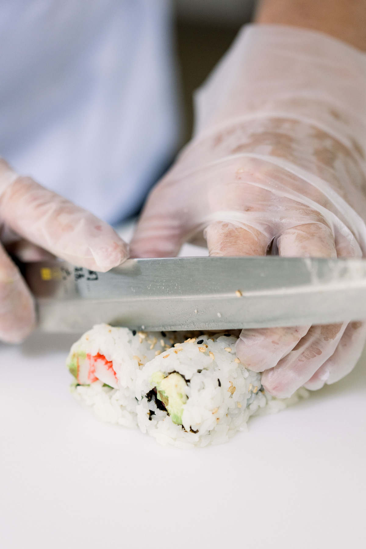 Cutting into a sushi roll